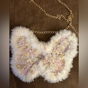 A pink butterfly bag, cross body bag